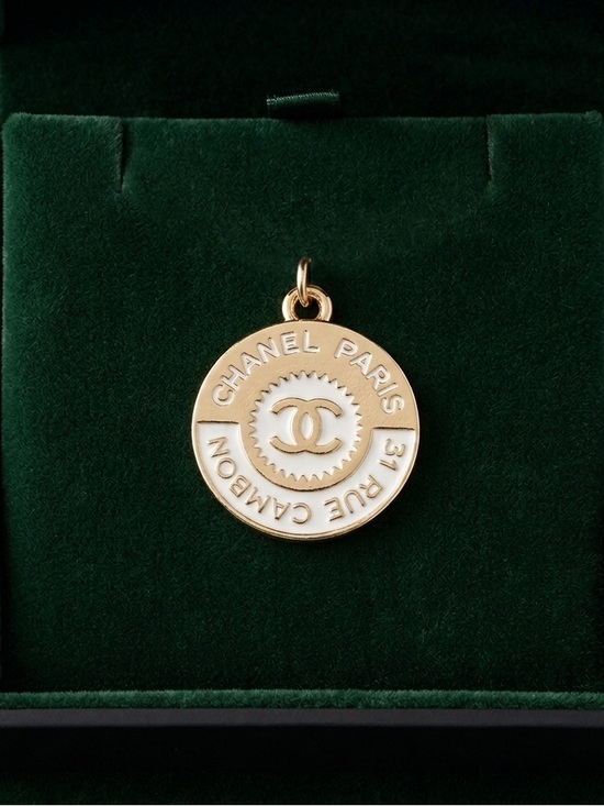 Chanel. Jewelry - ChaneI Gold and White Round Interlocking C Medallion Pendant